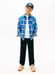 Boy modelling the Tommy Hilfiger check shirt.