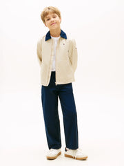 Boy modelling the Tommy Hilfiger chinos.