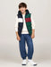 Boy modelling the Tommy Hilfiger colourblock gilet.