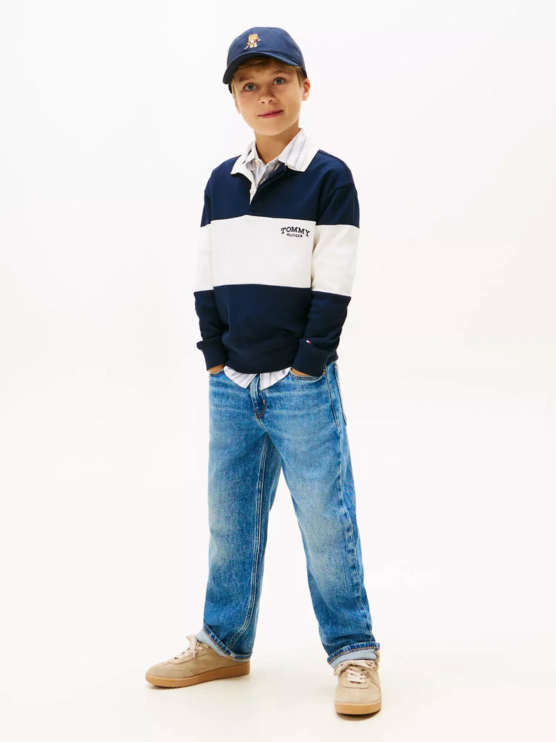 Boy wearing the Tommy Hilfiger colourblock polo shirt.