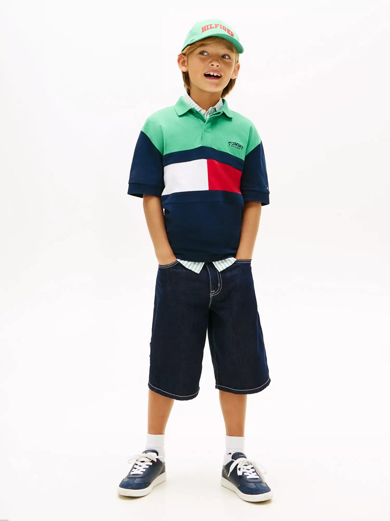 Boy wearing the Tommy Hilfiger colourblock polo shirt.