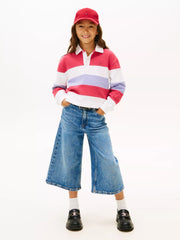 Girl wearing the Tommy Hilfiger colourblock polo shirt.