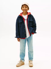 Boy wearing the Tommy Hilfiger corduroy shirt.