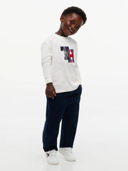 Boy modelling the Tommy Hilfiger crest t-shirt.