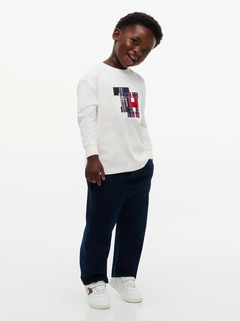 Boy modelling the Tommy Hilfiger crest t-shirt.