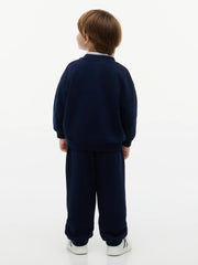 Rear view of the Tommy Hilfiger navy crest tracksuit.