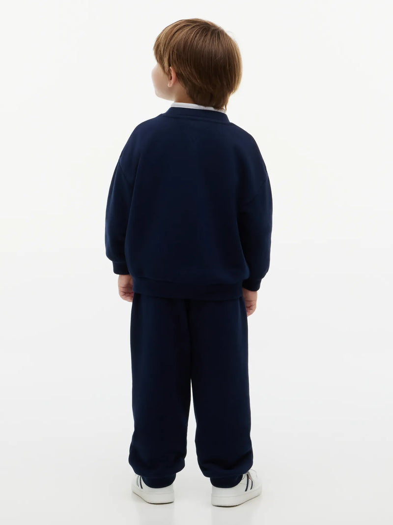 Rear view of the Tommy Hilfiger navy crest tracksuit.