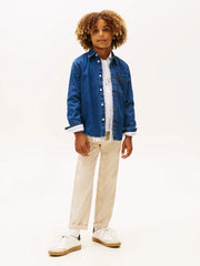 Boy wearing the Tommy Hilfiger denim shirt.