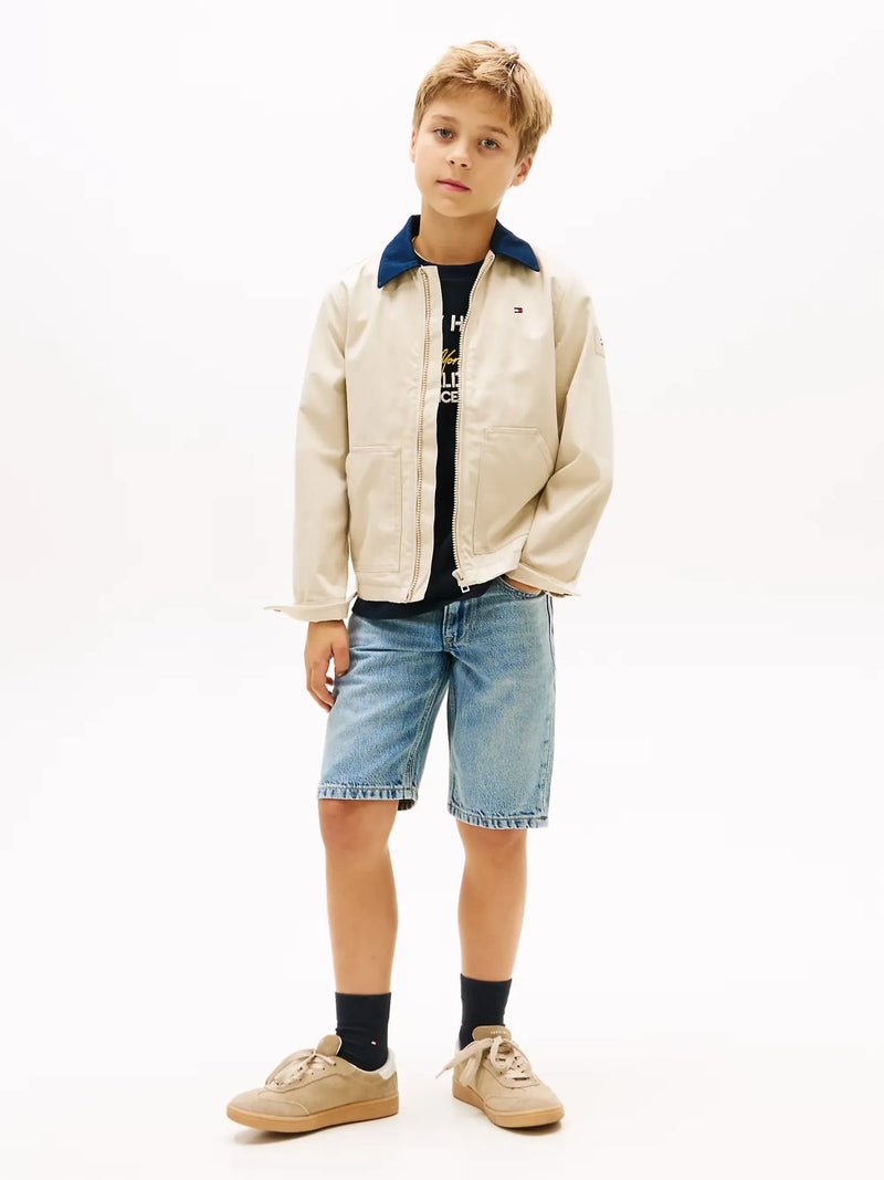 Boy wearing the Tommy Hilfiger denim shorts.