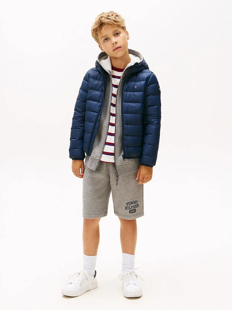 Boy wearing the Tommy Hilfiger down jacket.