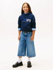 Girl modelling the Tommy Hilfiger embroidered hoodie.