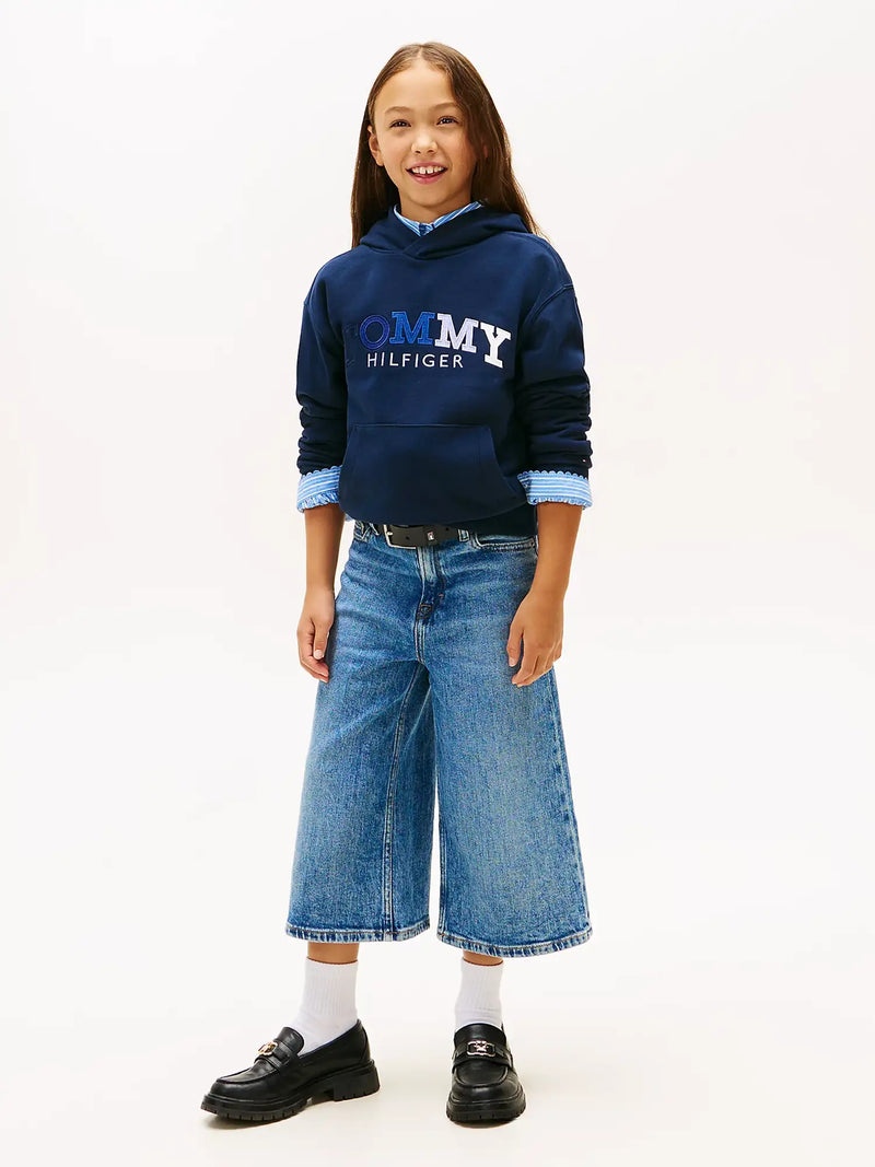 Girl modelling the Tommy Hilfiger embroidered hoodie.