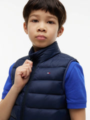 Boy wearing the Tommy Hilfiger essential down gilet.