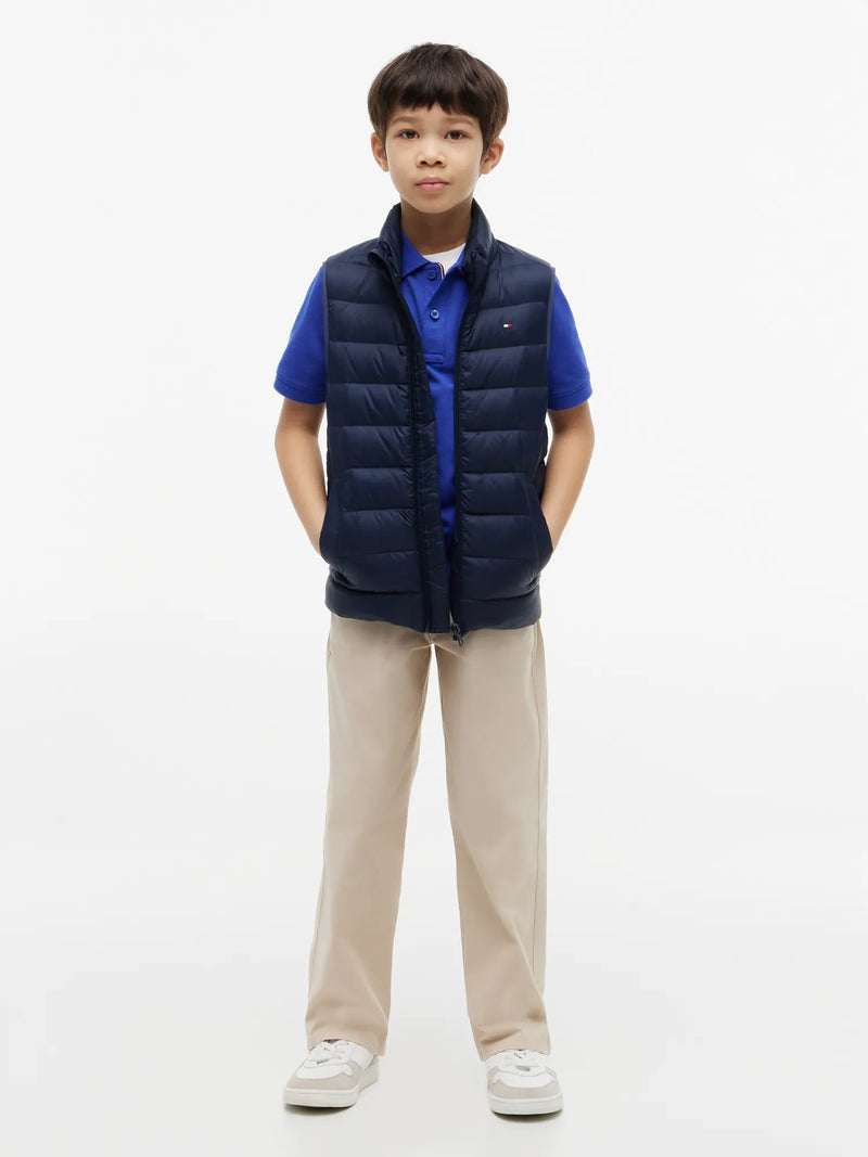 Boy wearing the Tommy Hilfiger essential down gilet.