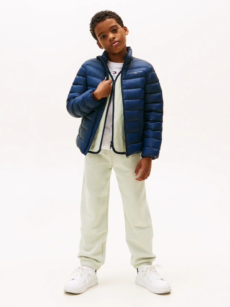 Boy modelling the Tommy Hilfiger essential down jacket.