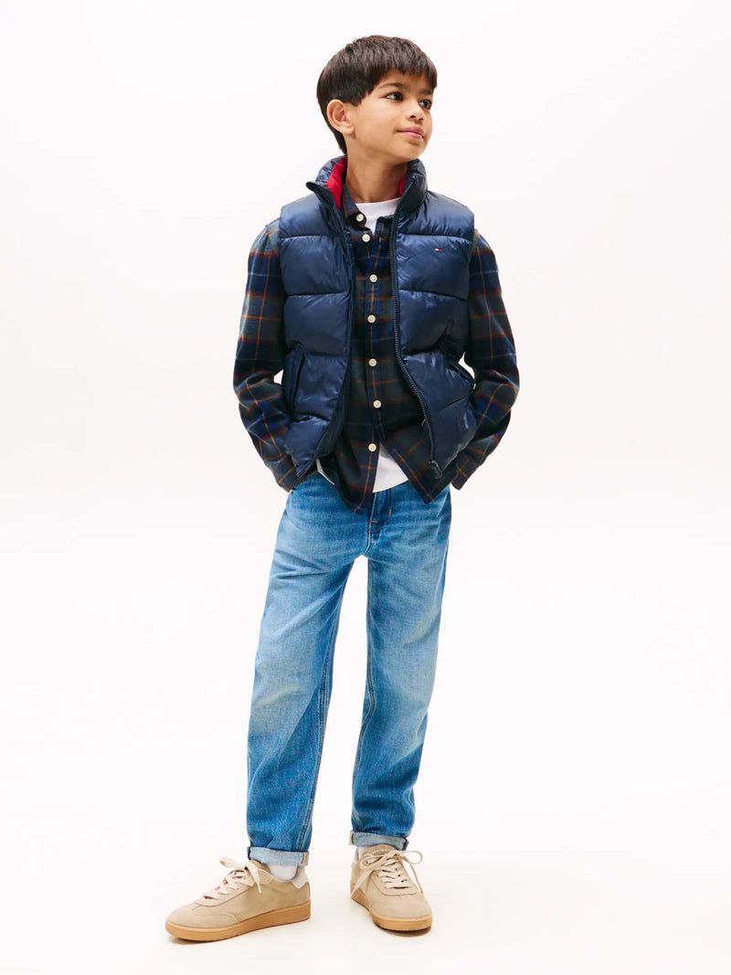 Boy modelling the Tommy Hilfiger essential gilet.