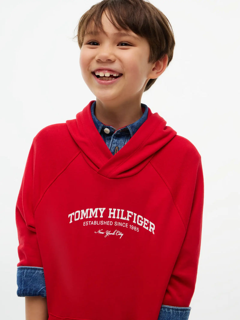 Smiling Boy modelling the Tommy Hilfiger essential hoodie.