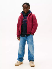 Boy wearing the Tommy Hilfiger essential padded jacket.