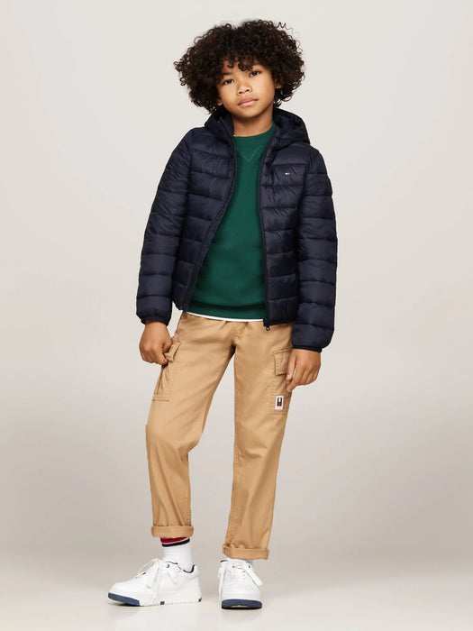 Boy wearing the Tommy Hilfiger essential puffer jacket.