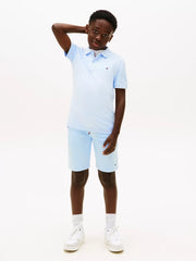 Smiling Boy modelling the Tommy Hilfiger flag polo shirt.