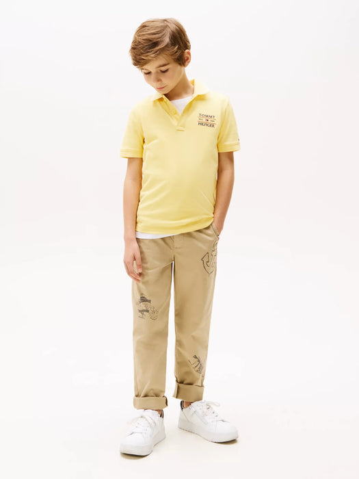 Tommy Hilfiger yellow flag polo shirt, modelled by boy.