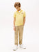 Tommy Hilfiger yellow flag polo shirt, modelled by boy.