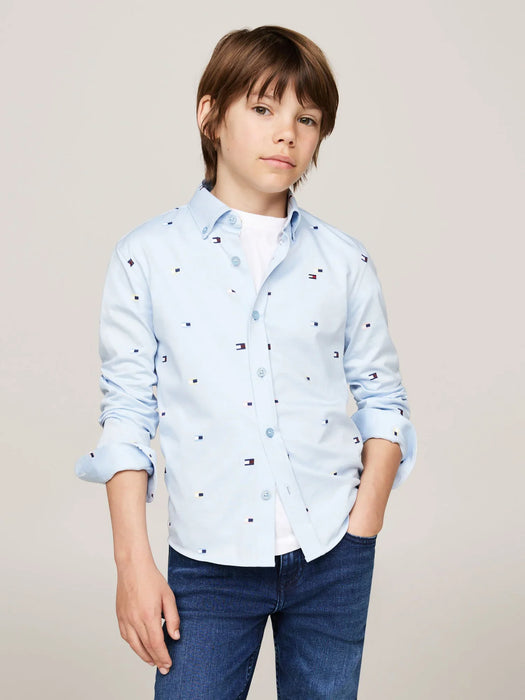 Boy wearing the Tommy Hilfiger flag print shirt.