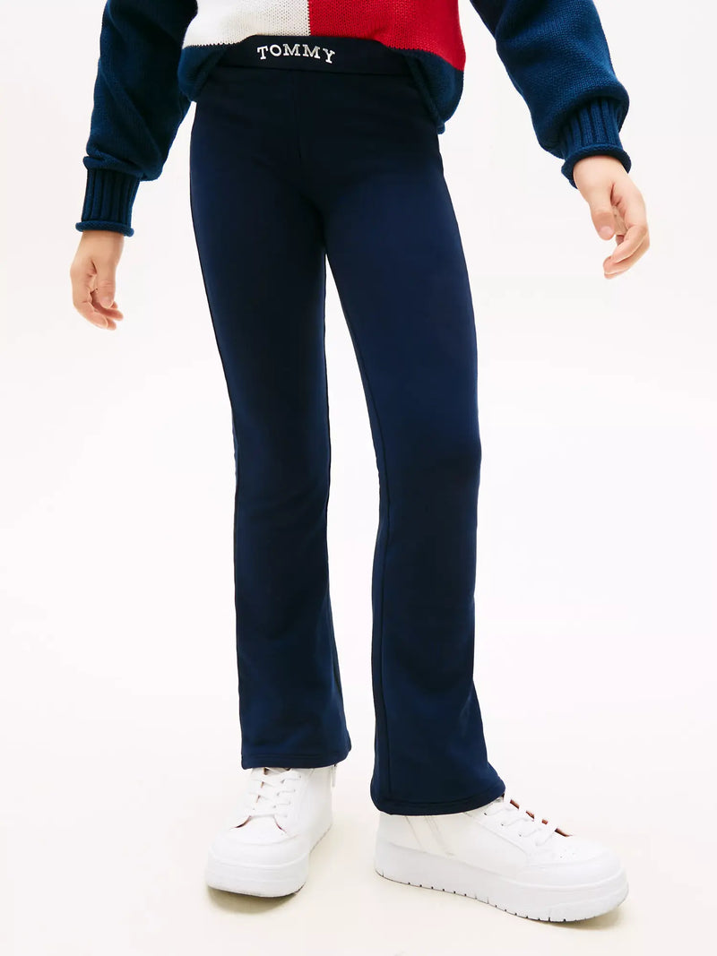 Closer look at the Tommy Hilfiger flared leggings showing detail of the silver foil logo.