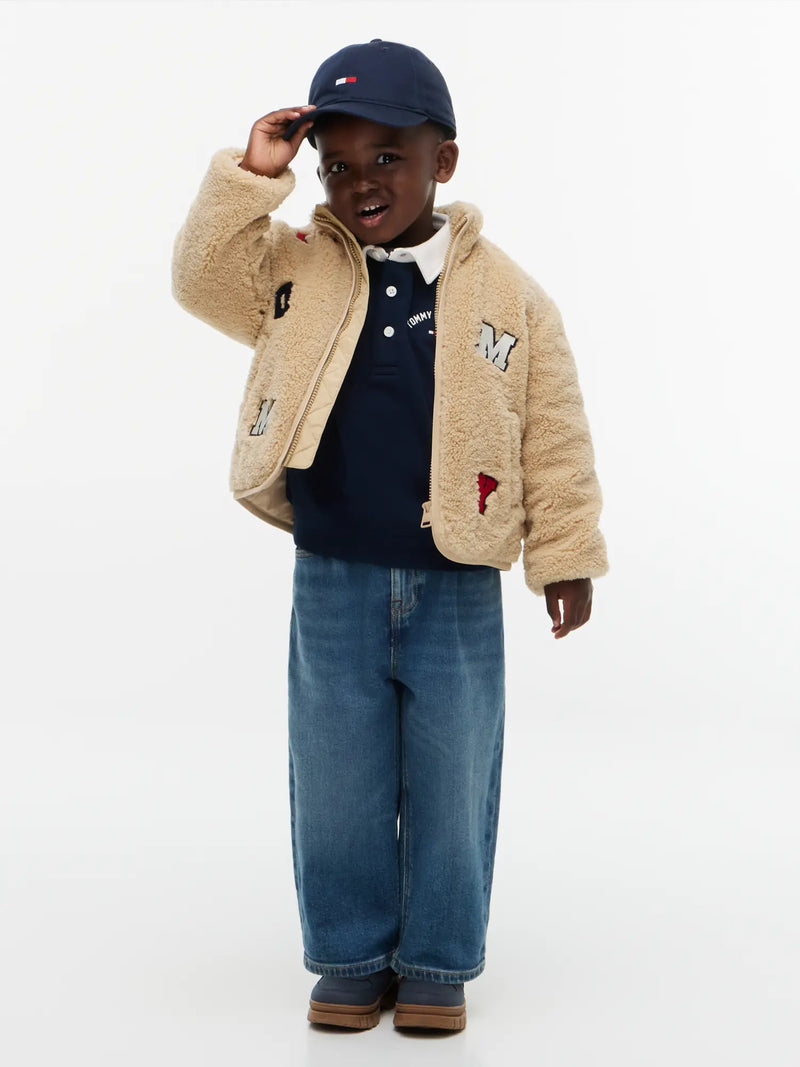 Boy wearing the Tommy Hilfiger fleece jacket.