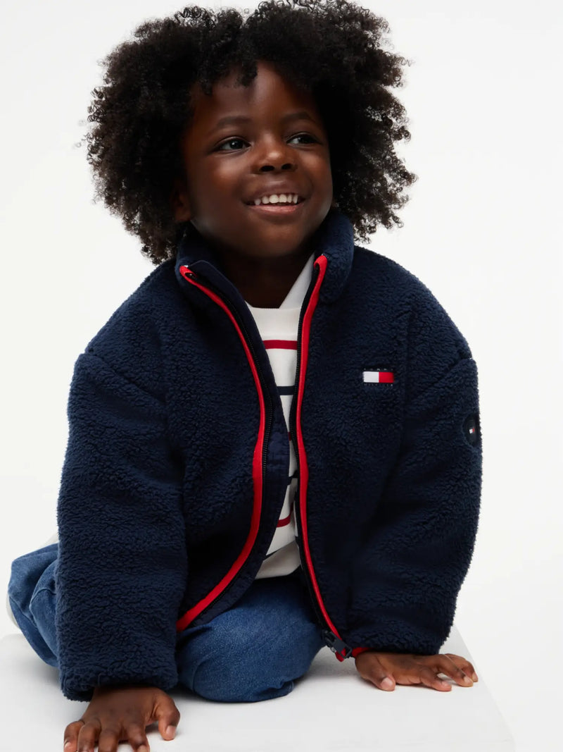 Boy wearing the Tommy Hilfiger fleece jacket.
