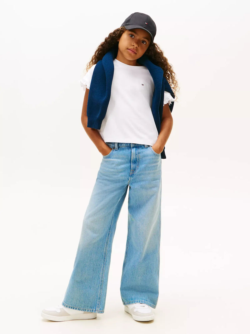 Girl wearing the Tommy Hilfiger frilled sleeve t-shirt.