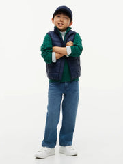 Smiling Boy modelling the Tommy Hilfiger gilet.