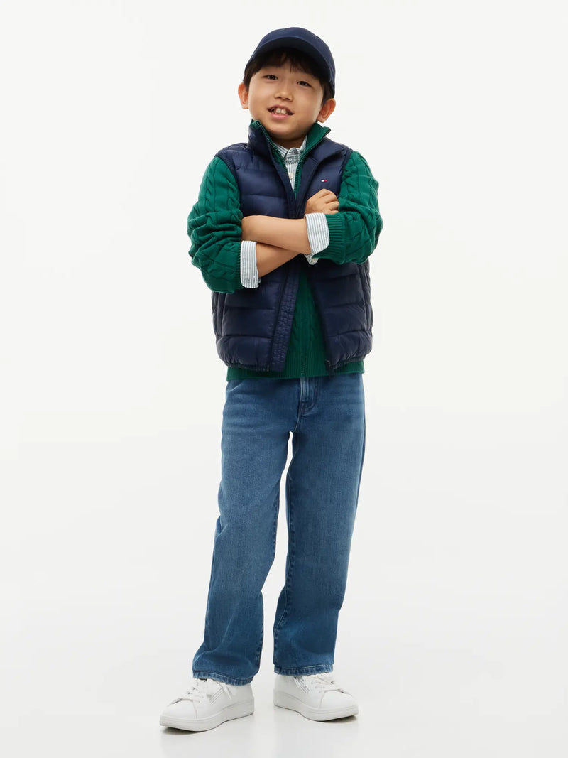 Smiling Boy modelling the Tommy Hilfiger gilet.
