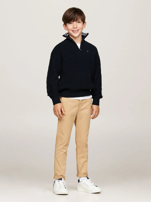 Boy wearing the Tommy Hilfiger half zip sweater.