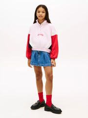Girl wearing the Tommy Hilfiger half zip sweatshirt.