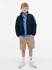 Boy wearing the Tommy Hilfiger heritage essential jacket.