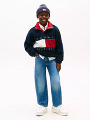Boy modelling the Tommy Hilfiger heritage flag fleece sweatshirt.