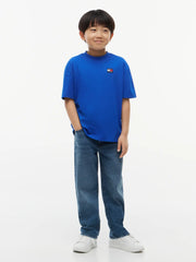 Boy in blue heritage t-shirt by Tommy Hilfiger.