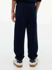 Back of the Tommy Hilfiger navy heritage track bottoms.