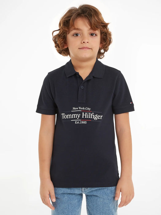Boy wearing the Tommy Hilfiger icon polo shirt.