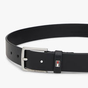 Closer look at the Tommy Hilfiger leather belt showing detail of the enamel flag branding.