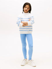 Tommy Hilfiger blue leggings, modelled by girl.