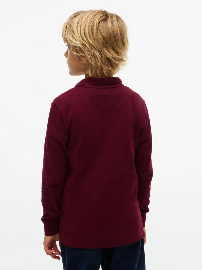 Back of the Tommy Hilfiger burgundy long sleeve polo shirt.