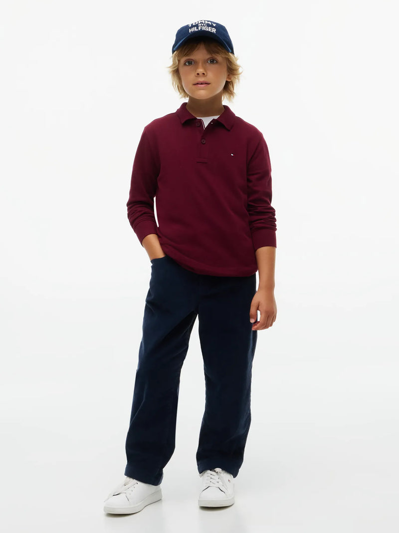Boy wearing the Tommy Hilfiger long sleeve polo shirt.