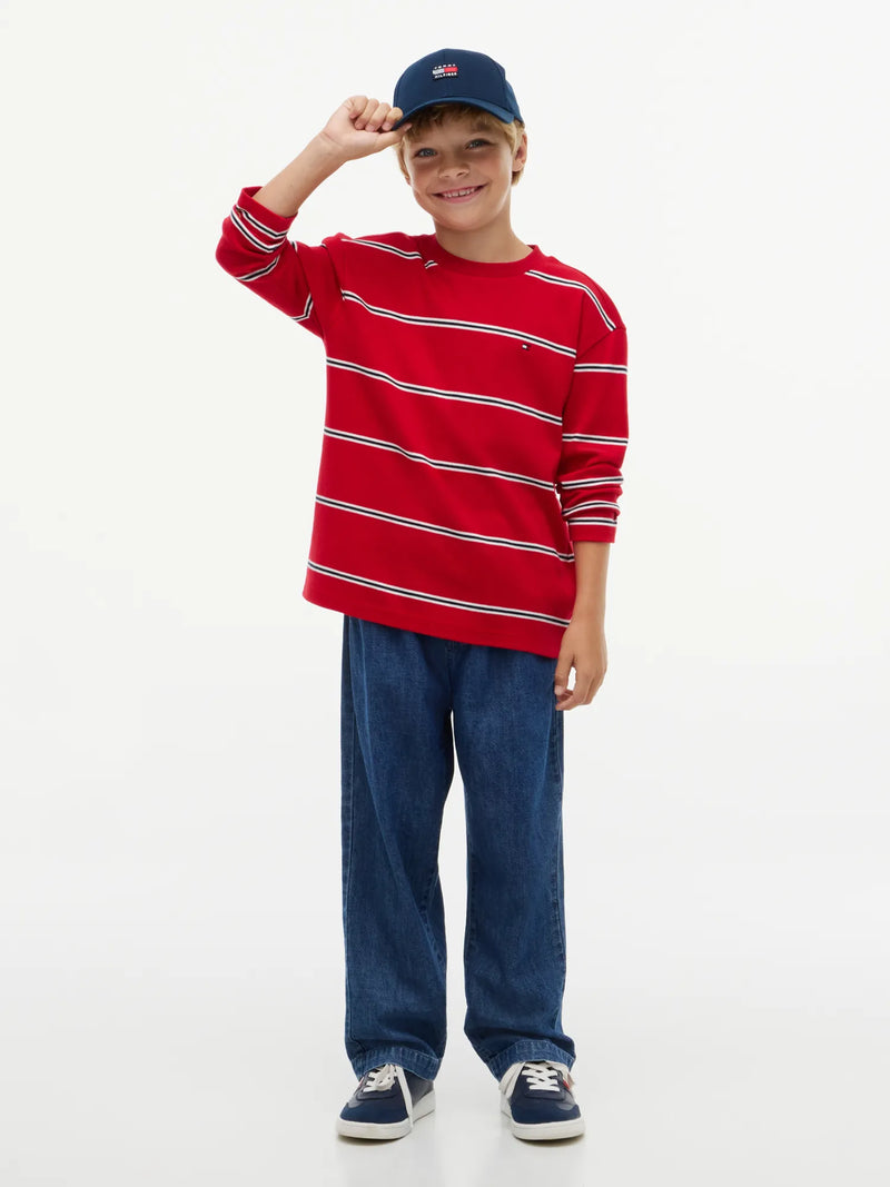 Smiling Boy modelling the Tommy Hilfiger long sleeve striped t-shirt.