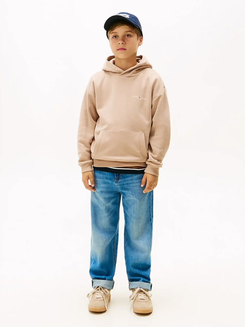 Boy wearing the Tommy Hilfiger mini logo hoodie.