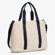 Back of the Tommy Hilfiger cream monotype bag.