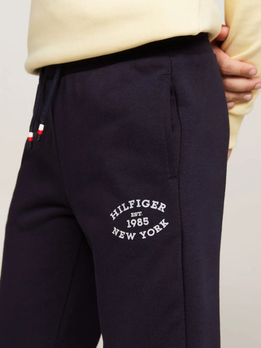 Closer view of the Tommy Hilfiger monotype track bottoms.