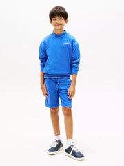 Boy modelling the Tommy Hilfiger monotype track shorts.