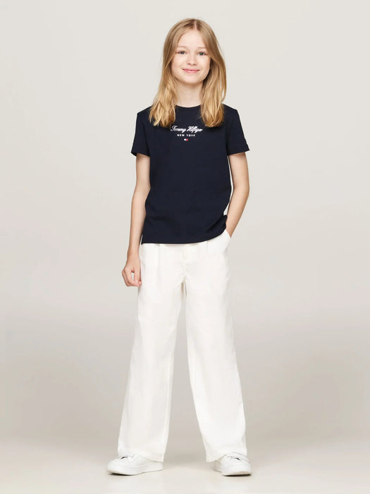 Smiling girl modelling the Tommy Hilfiger nyc t-shirt.